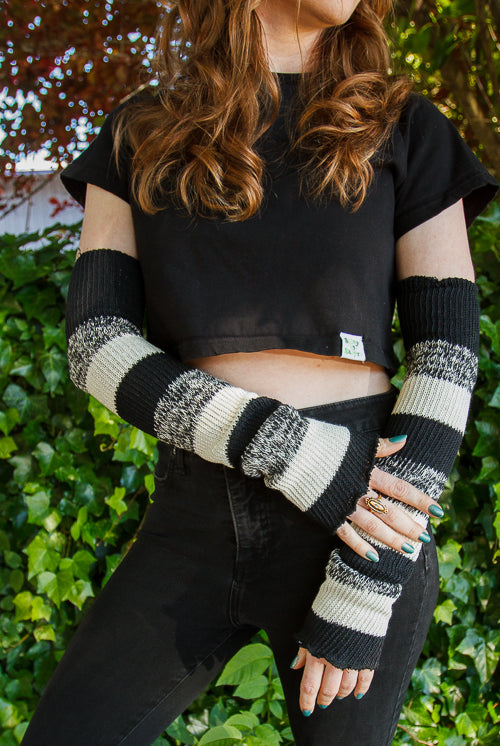 A person wearing cookies and cream stripes warmers