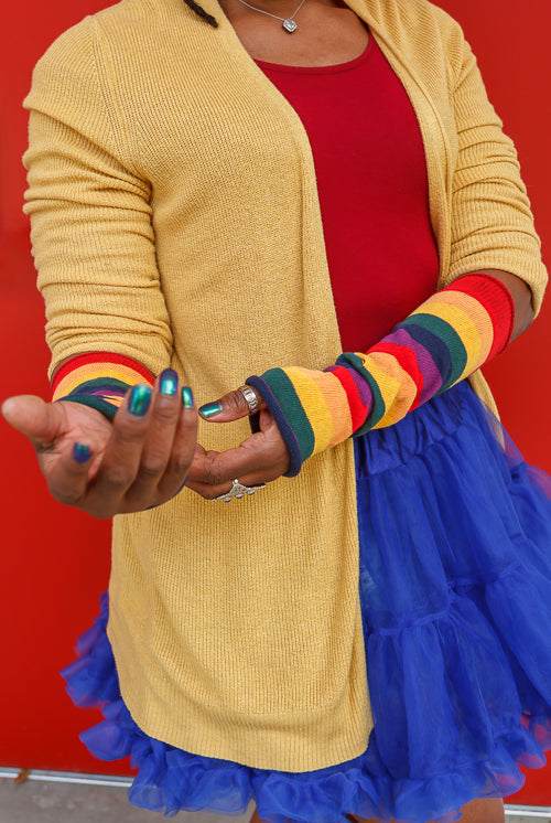 A person wearing M Sleeves in rainbow
