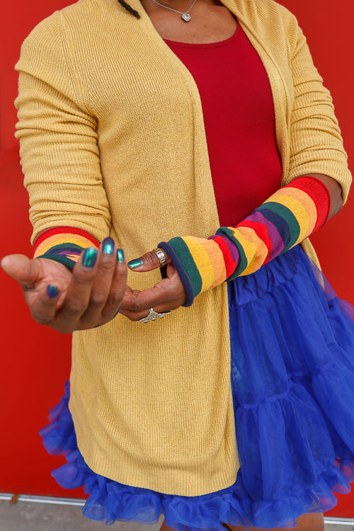 A person wearing M Sleeves in rainbow