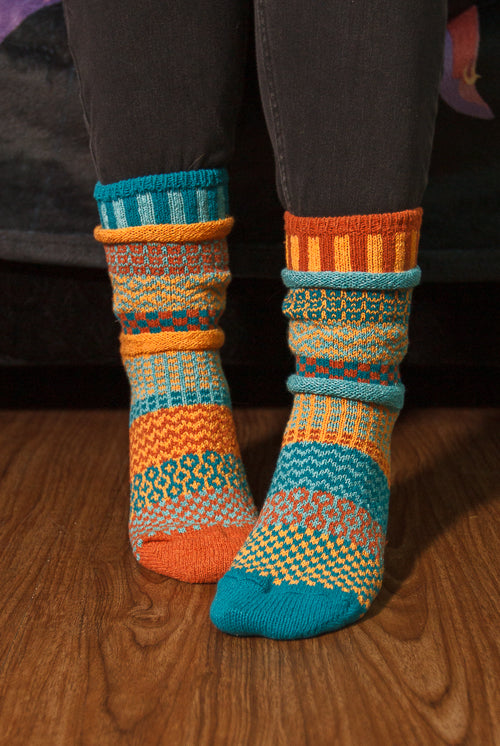 A person wearing Dune crew socks