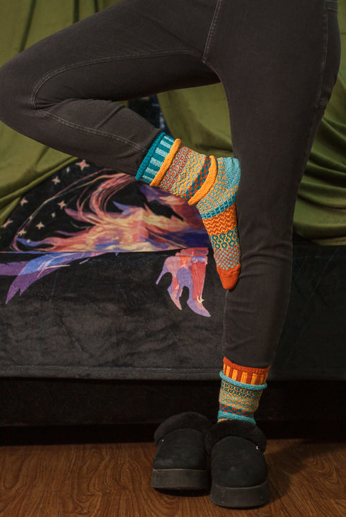 A person wearing Dune crew socks
