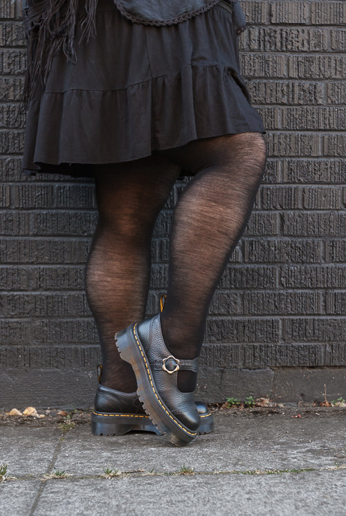 A person wearing Jennifer Wool Tights in black
