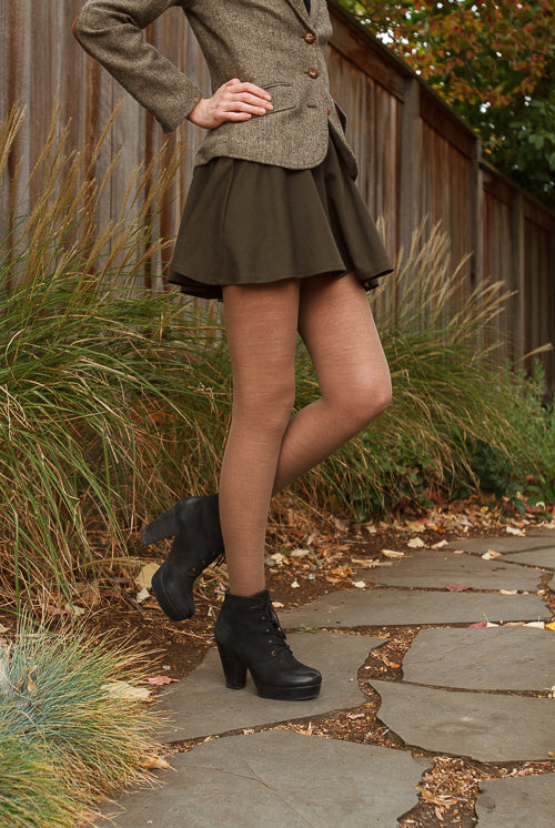 A person wearing Jennifer Wool Tights in hazelnut