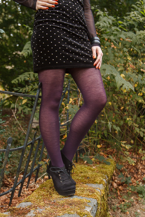 A person wearing Jennifer Wool Tights in prune