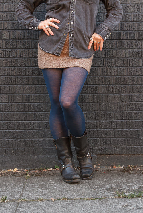 A person wearing Jennifer Wool Tights in sapphire