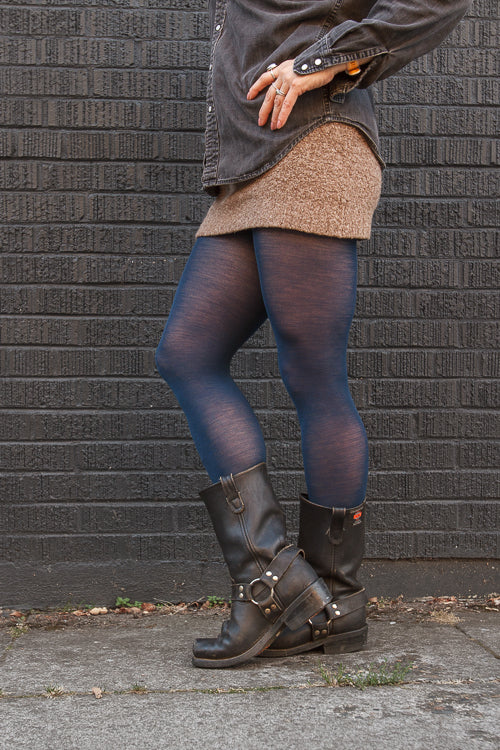 A person wearing Jennifer Wool Tights in sapphire