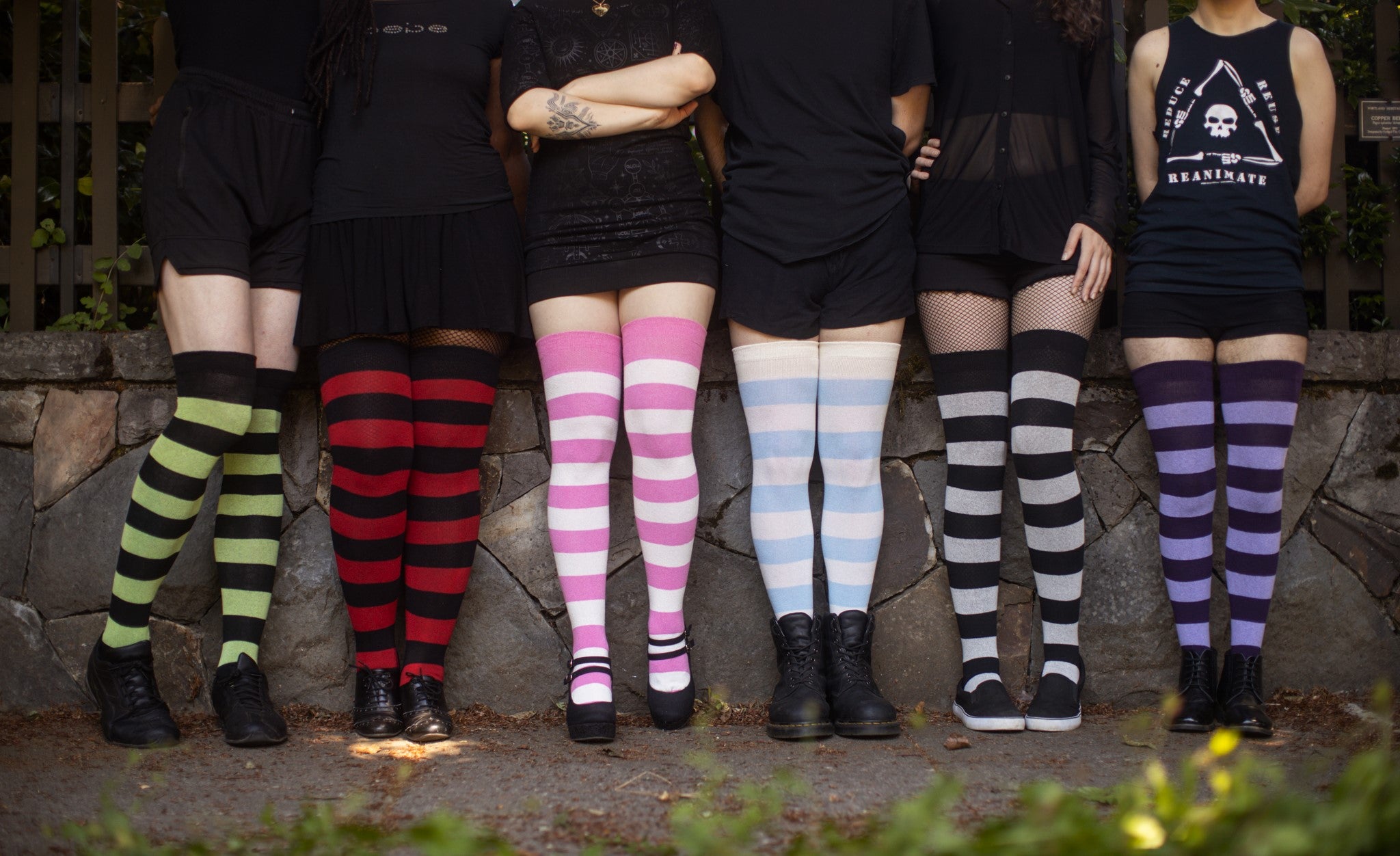 six models in different colorways of Extraordinarily Striped Thigh High Socks