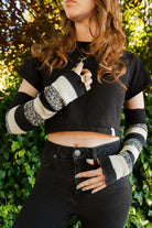 A person wearing cookies and cream stripes warmers