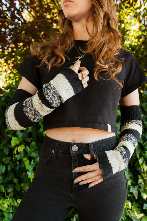 A person wearing cookies and cream stripes warmers