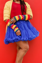 A person wearing M Sleeves in rainbow