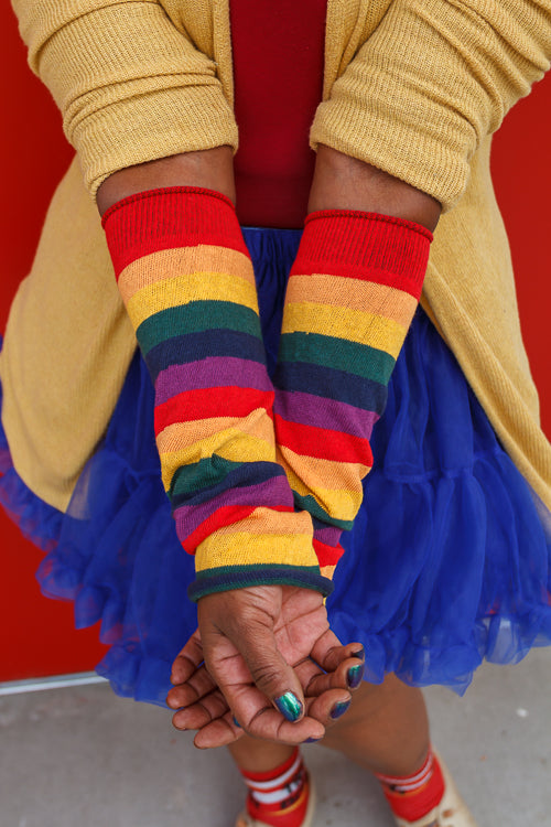 A person wearing M Sleeves in rainbow