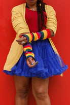 A person wearing M Sleeves in rainbow