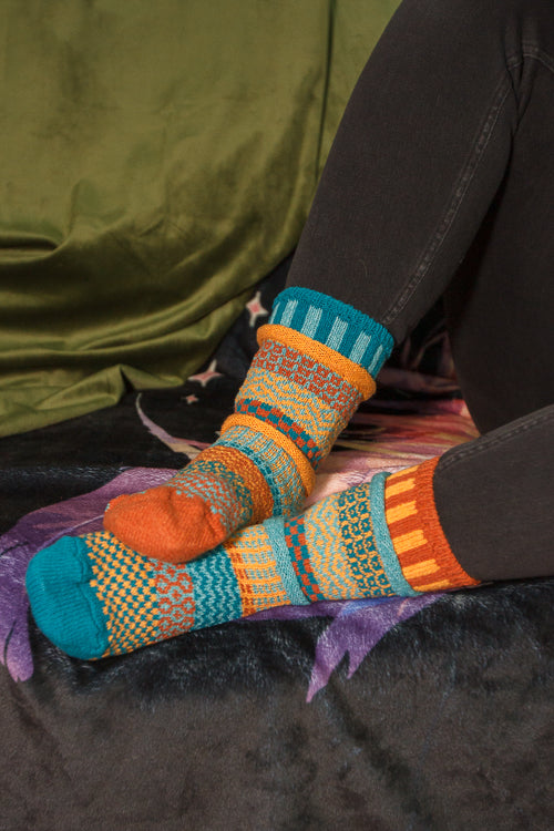 A person wearing Dune crew socks