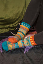 A person wearing Dune crew socks