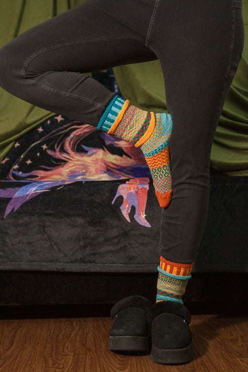 A person wearing Dune crew socks