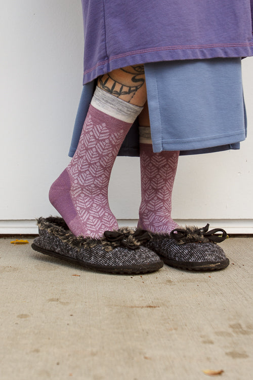 A person wearing bunion relief tabi socks in orchid
