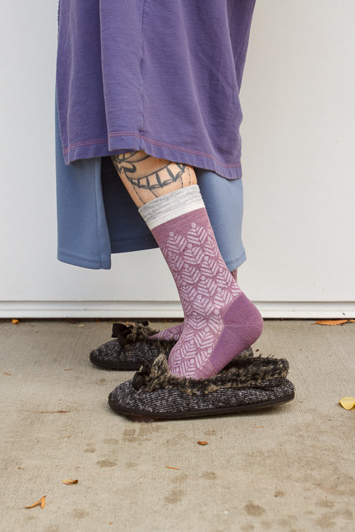 A person wearing bunion relief tabi socks in orchid