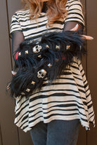 A person wearing Furtastic arm warmers