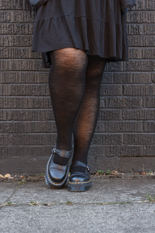 A person wearing Jennifer Wool Tights in black