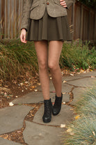 A person wearing Jennifer Wool Tights in hazelnut