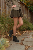 A person wearing Jennifer Wool Tights in hazelnut