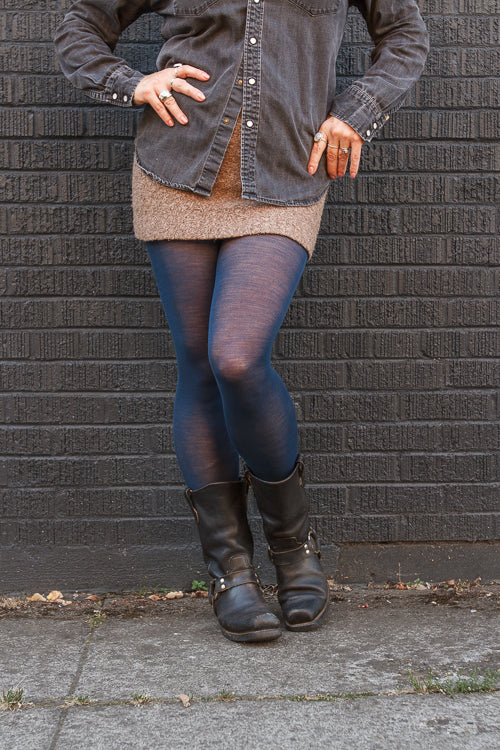 A person wearing Jennifer Wool Tights in sapphire